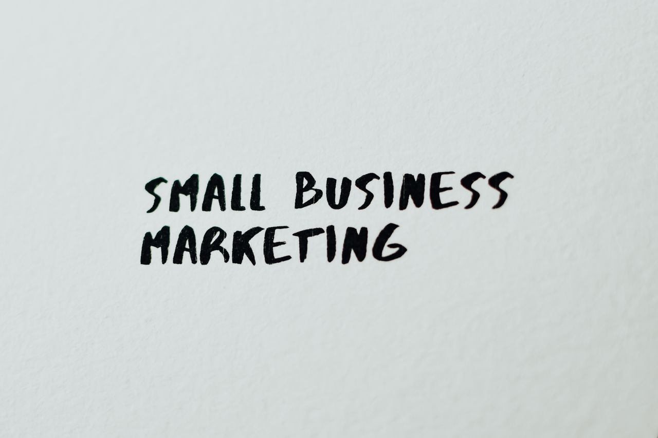 services-01 Text Small Business Marketing written on white paper for creative use.