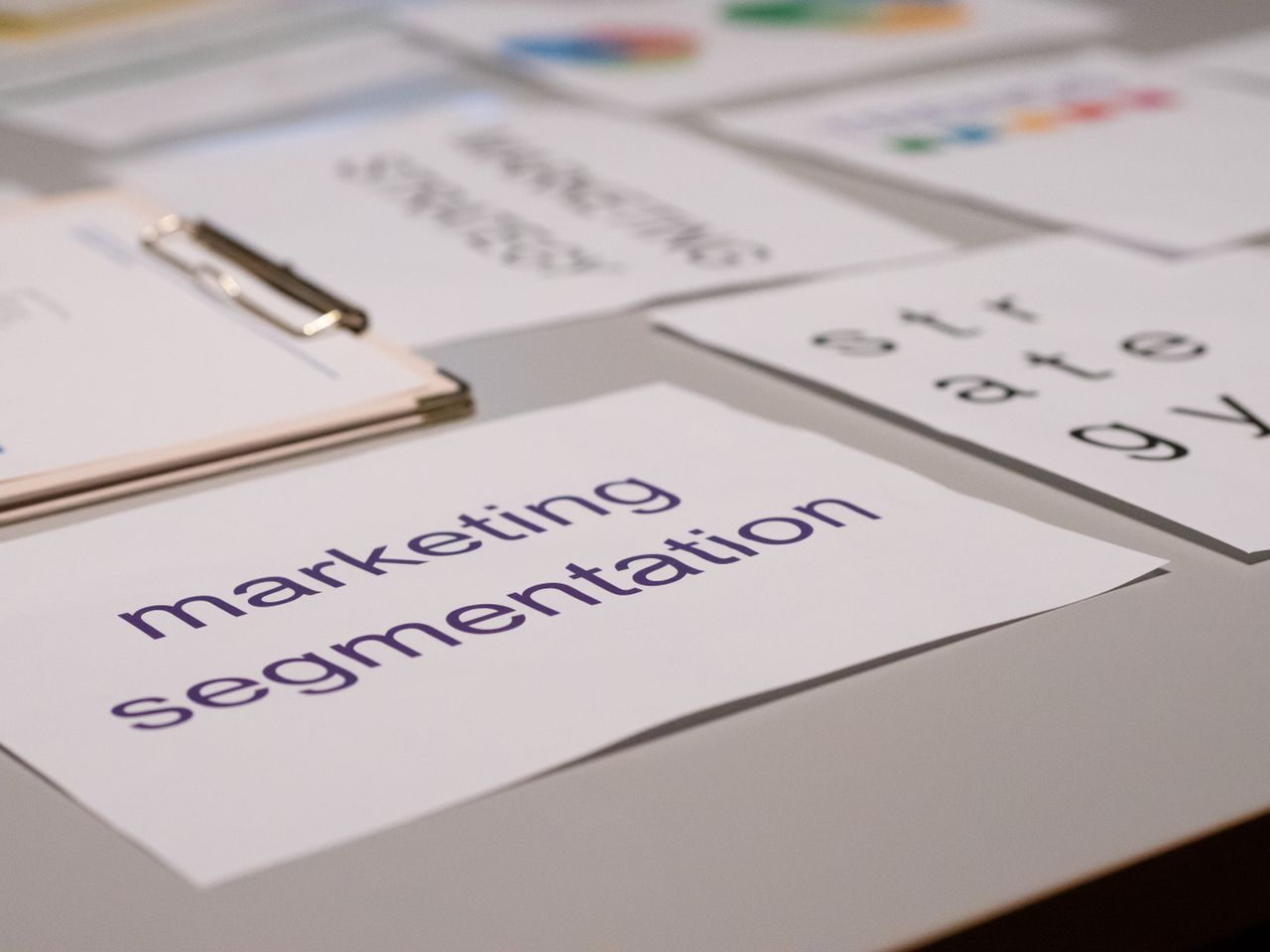 about-us-01 Close-up of various marketing documents on a desk, perfect for business and strategy discussions.